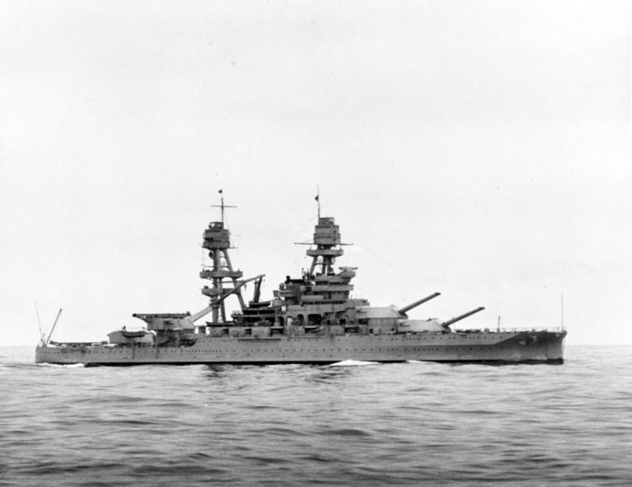 USS Arizona at sea in the 1930s, with her main battery trained to port.