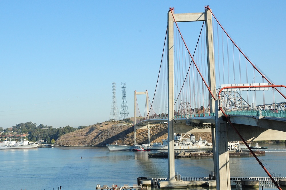 Iowa under tow beneath the Carquinez Bridge on 28 October 2011, before restoration as a museum. The appearance of U.S. Department of War (DoW) visual information does not imply or constitute DoW endorsement.