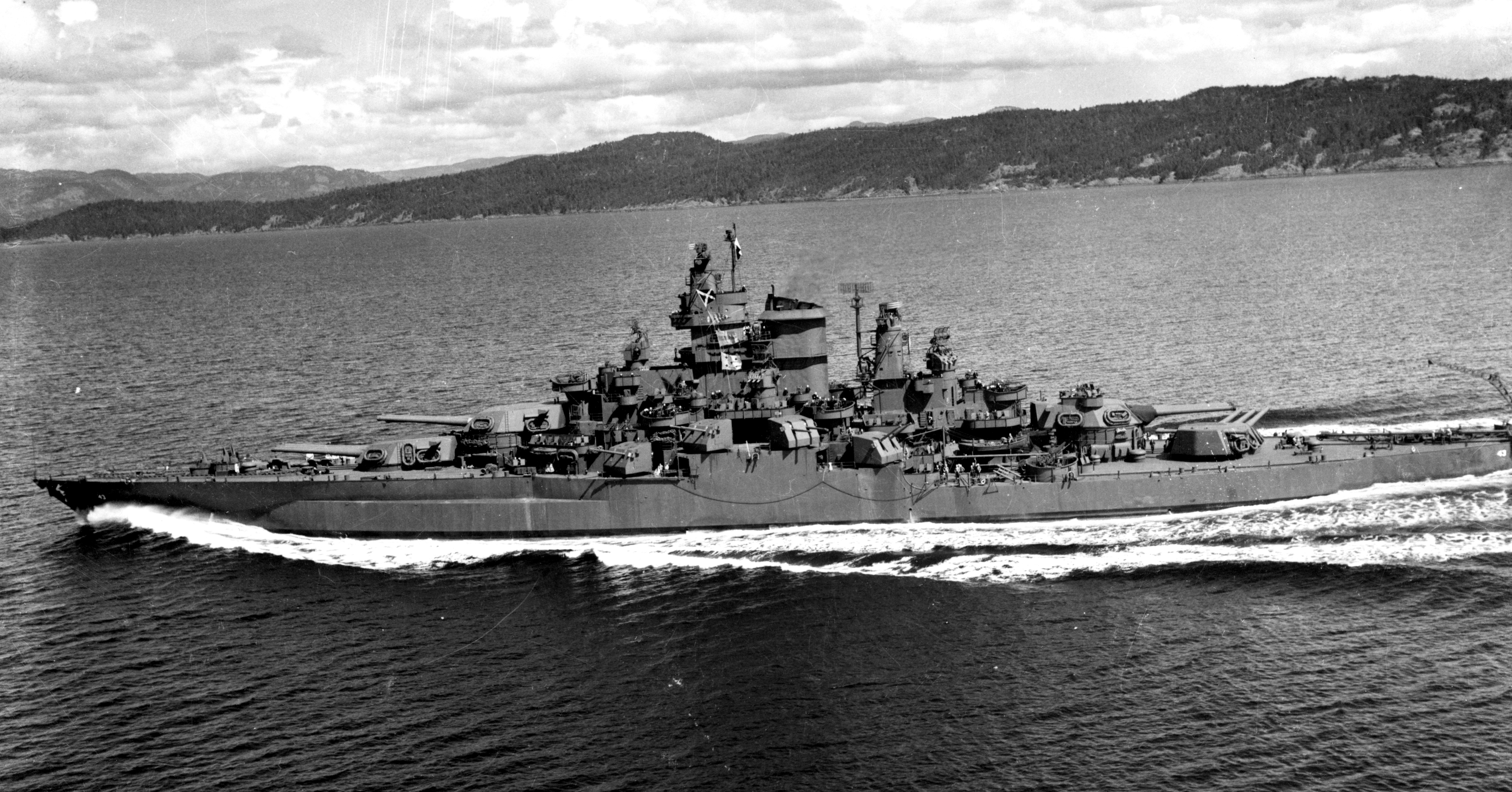 Tennessee underway in Puget Sound on 12 May 1943 after modernization. Her rebuilt superstructure distinguishes this appearance from her Pearl Harbor configuration.